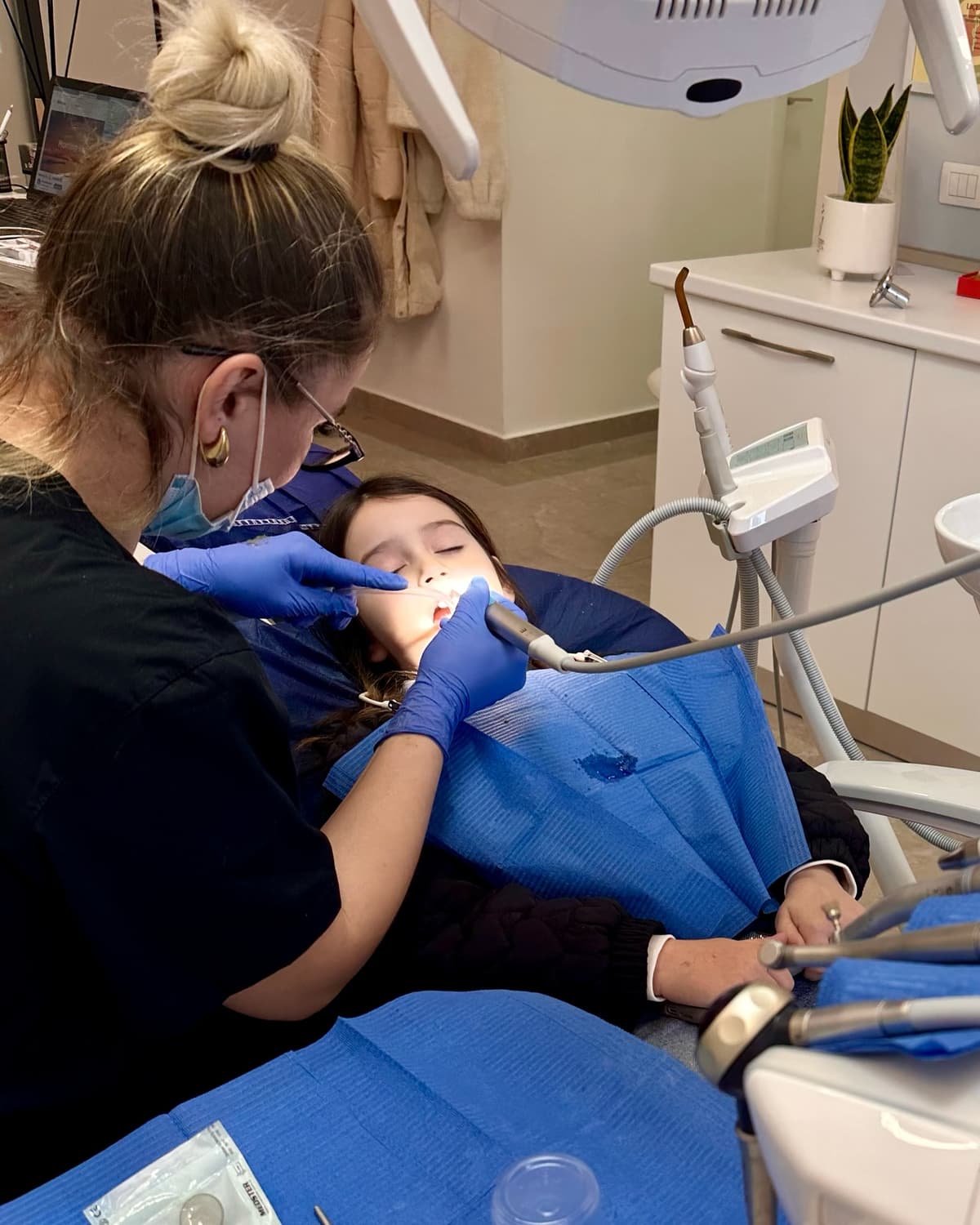 Dr. Kedri Peza treating a patient